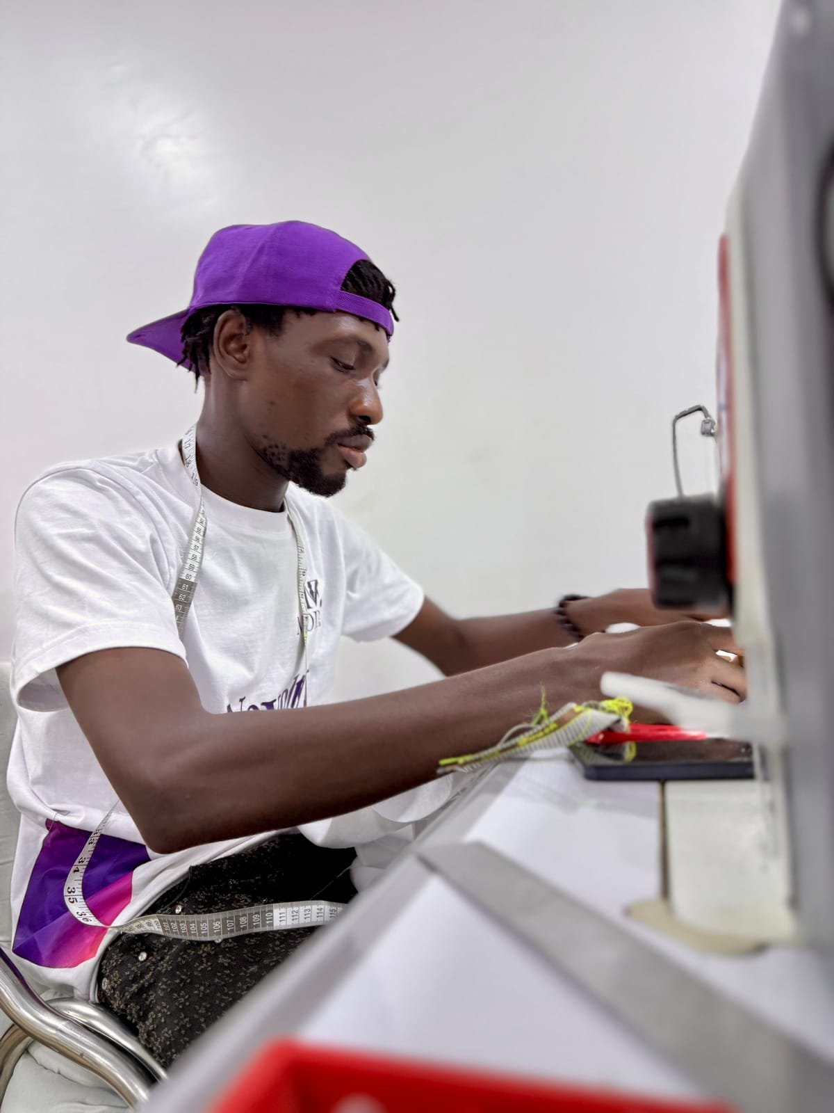 A Modish machinist sewing at an industrial machine