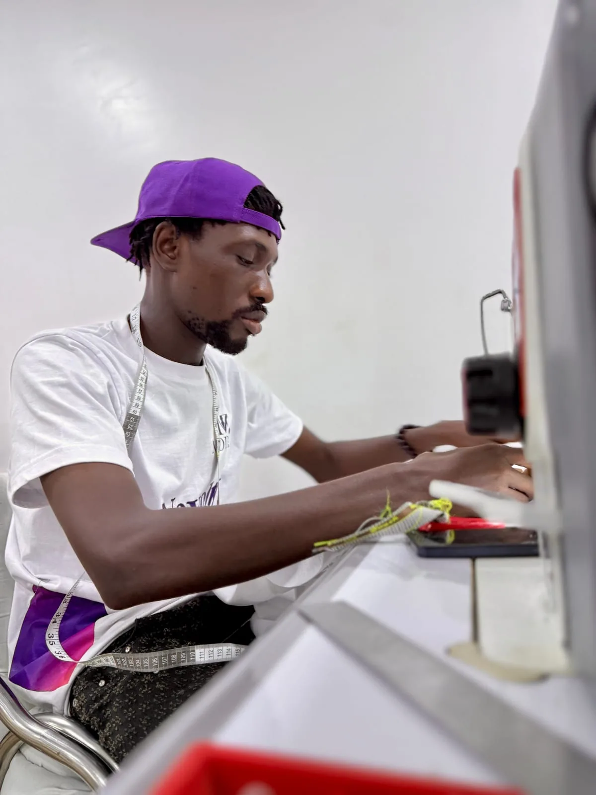 A Modish machinist sewing at an industrial machine